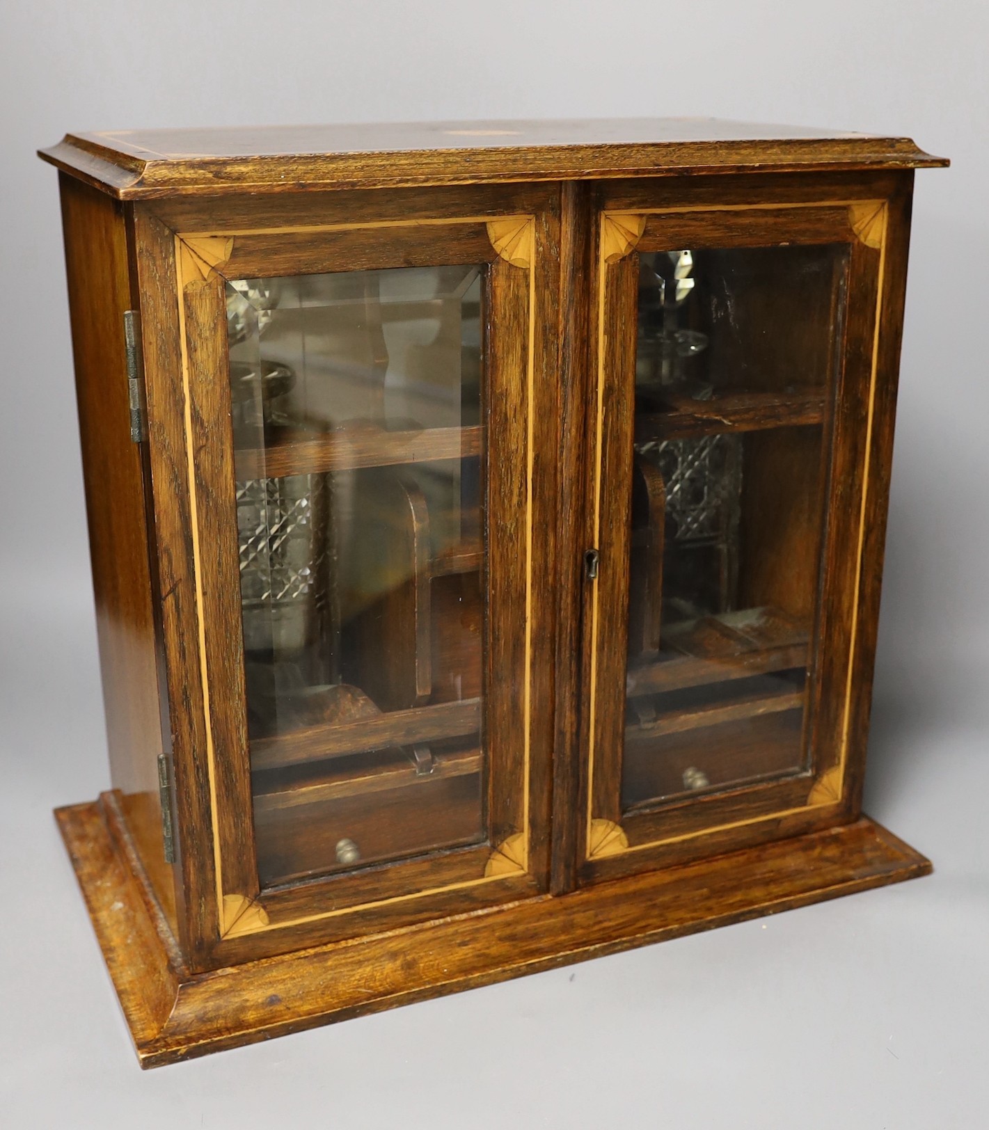 An Edwardian inlaid oak drinks cabinet, with two cut glass decanters, 40 cms wide x 37 cms high